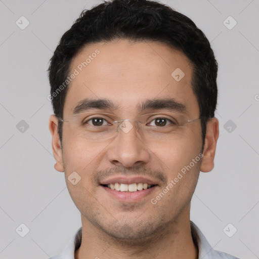 Joyful white young-adult male with short  black hair and brown eyes