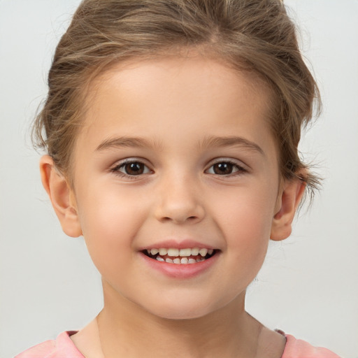 Joyful white child female with short  brown hair and brown eyes