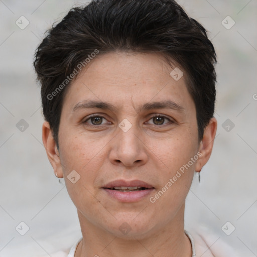 Joyful white adult female with short  brown hair and brown eyes