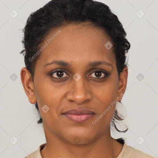 Joyful black young-adult female with short  brown hair and brown eyes