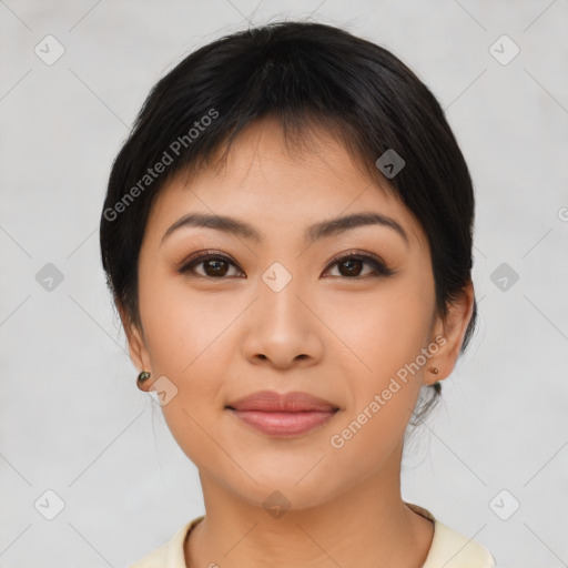Joyful asian young-adult female with medium  brown hair and brown eyes