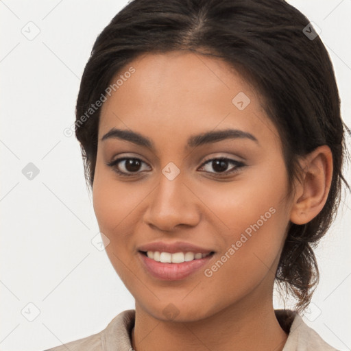 Joyful latino young-adult female with long  brown hair and brown eyes