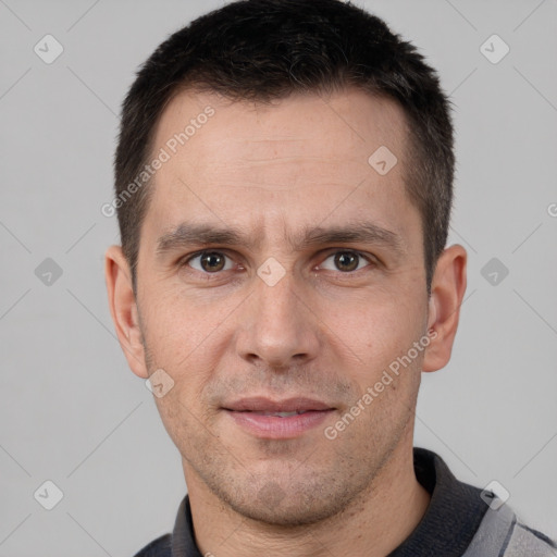 Joyful white adult male with short  brown hair and brown eyes