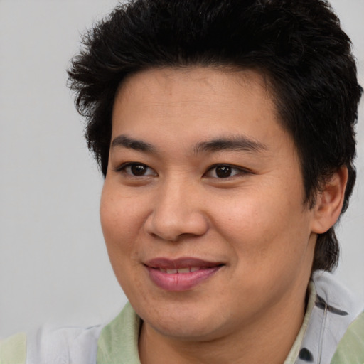Joyful asian young-adult female with short  brown hair and brown eyes
