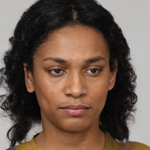 Neutral black adult female with medium  black hair and brown eyes