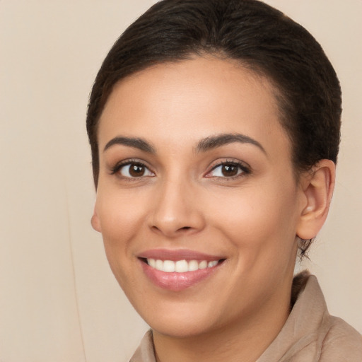 Joyful white young-adult female with long  brown hair and brown eyes