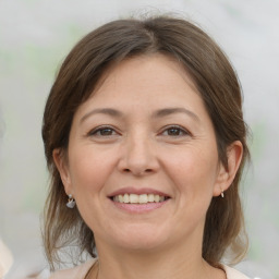 Joyful white adult female with medium  brown hair and brown eyes