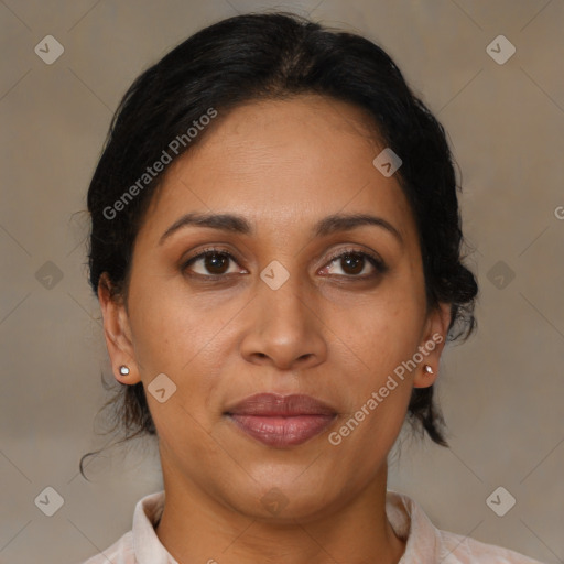 Joyful latino young-adult female with medium  brown hair and brown eyes