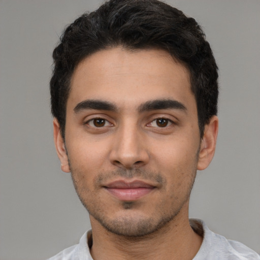 Neutral latino young-adult male with short  black hair and brown eyes