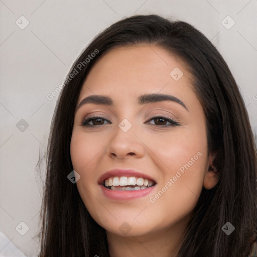 Joyful white young-adult female with long  black hair and brown eyes