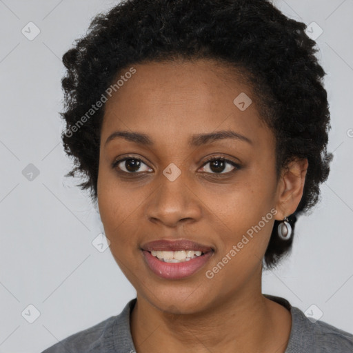 Joyful black young-adult female with short  black hair and brown eyes