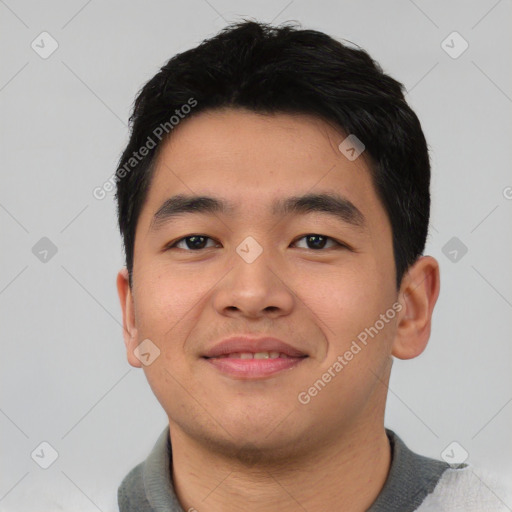 Joyful asian young-adult male with short  black hair and brown eyes