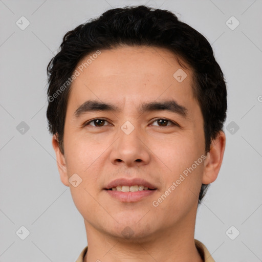 Joyful white young-adult male with short  black hair and brown eyes