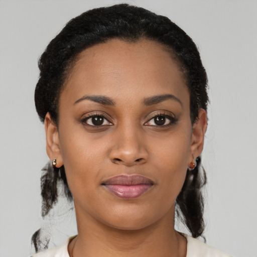 Joyful latino young-adult female with medium  black hair and brown eyes