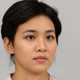 Neutral asian young-adult female with medium  brown hair and brown eyes