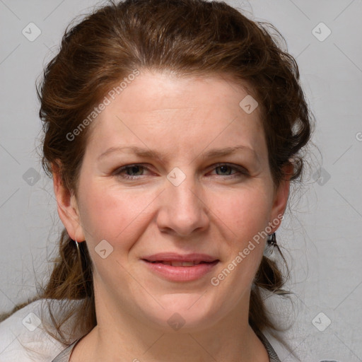 Joyful white young-adult female with medium  brown hair and blue eyes