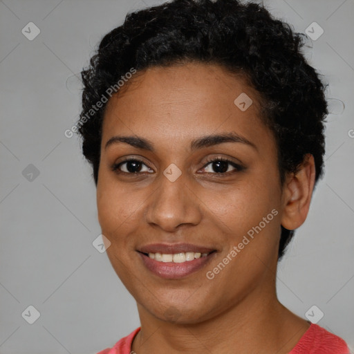 Joyful black young-adult female with short  brown hair and brown eyes