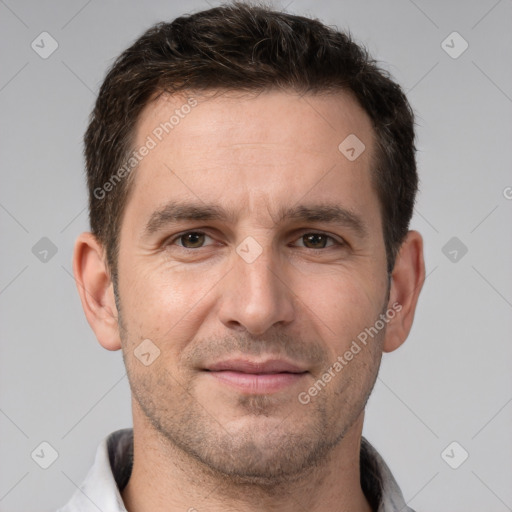 Joyful white adult male with short  brown hair and brown eyes