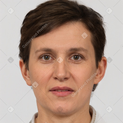 Joyful white adult female with short  brown hair and brown eyes