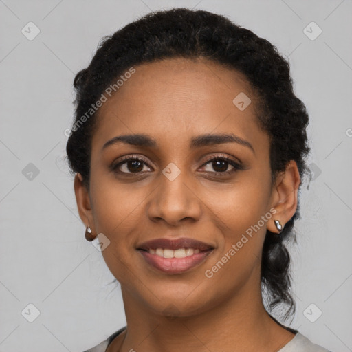 Joyful black young-adult female with short  black hair and brown eyes