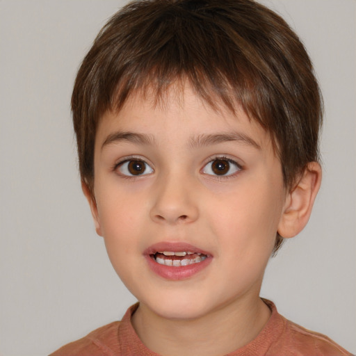 Joyful white child male with short  brown hair and brown eyes