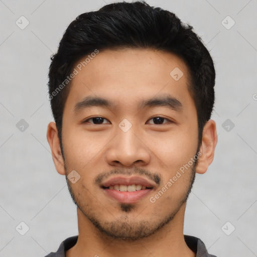 Joyful asian young-adult male with short  black hair and brown eyes