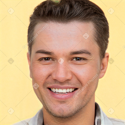 Joyful white young-adult male with short  brown hair and brown eyes