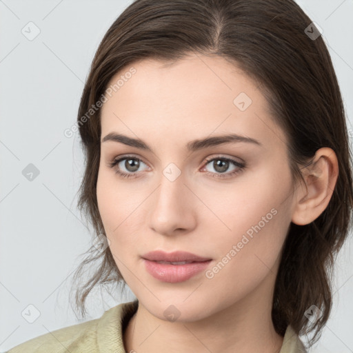 Neutral white young-adult female with medium  brown hair and brown eyes