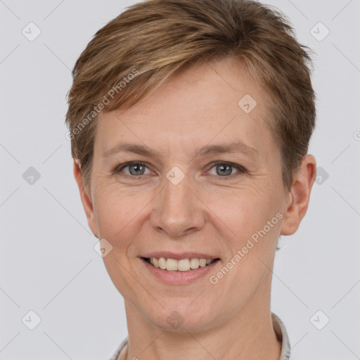 Joyful white adult female with short  brown hair and brown eyes