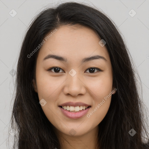 Joyful asian young-adult female with long  brown hair and brown eyes