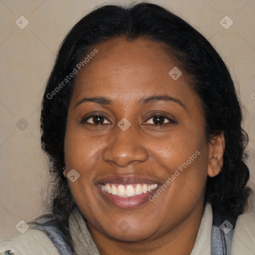 Joyful black adult female with medium  black hair and brown eyes