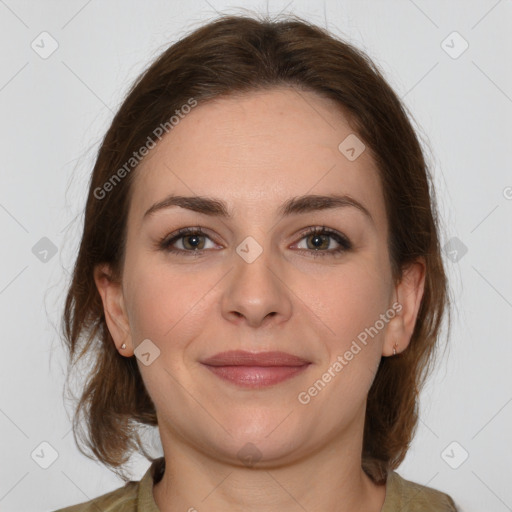 Joyful white young-adult female with medium  brown hair and grey eyes