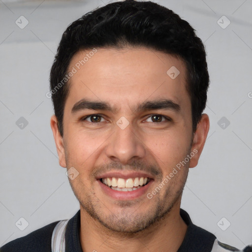 Joyful white young-adult male with short  black hair and brown eyes