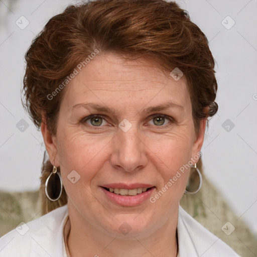 Joyful white adult female with medium  brown hair and blue eyes