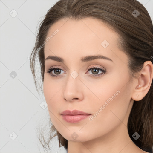 Neutral white young-adult female with long  brown hair and brown eyes