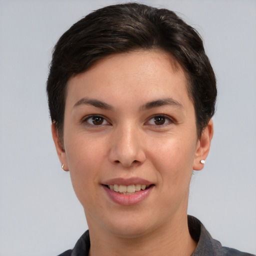 Joyful white young-adult female with short  brown hair and brown eyes
