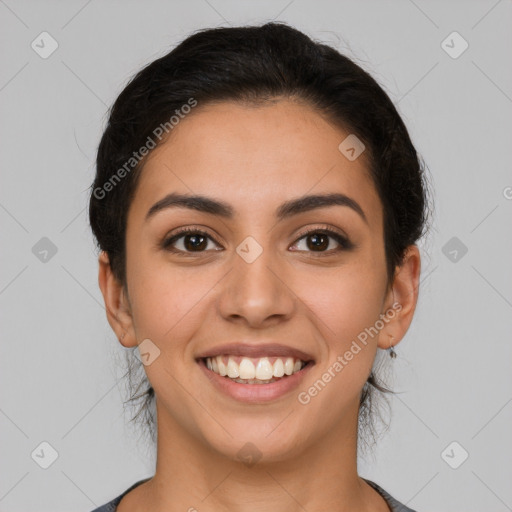 Joyful latino young-adult female with long  brown hair and brown eyes