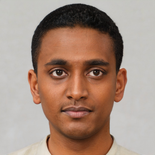 Neutral black young-adult male with short  black hair and brown eyes