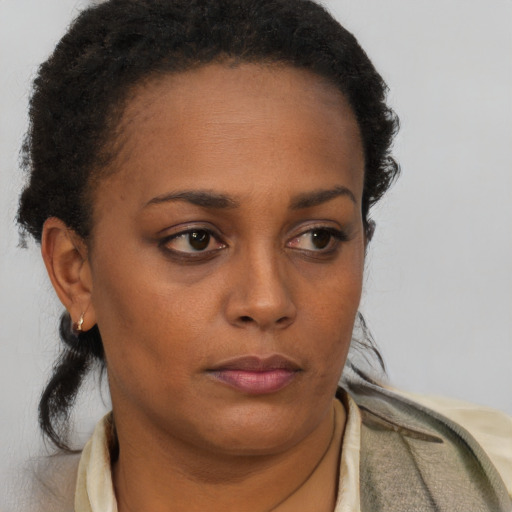 Neutral black young-adult female with short  brown hair and brown eyes