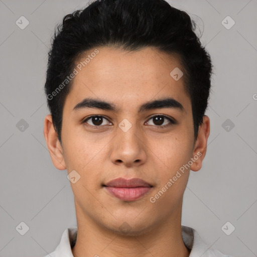 Joyful latino young-adult male with short  black hair and brown eyes