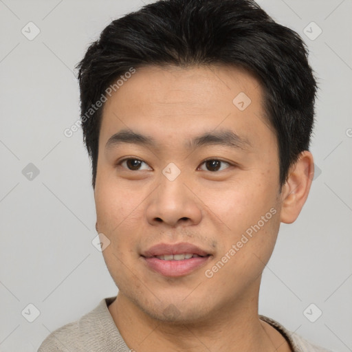 Joyful asian young-adult male with short  black hair and brown eyes