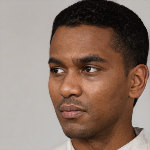 Neutral black young-adult male with short  black hair and brown eyes