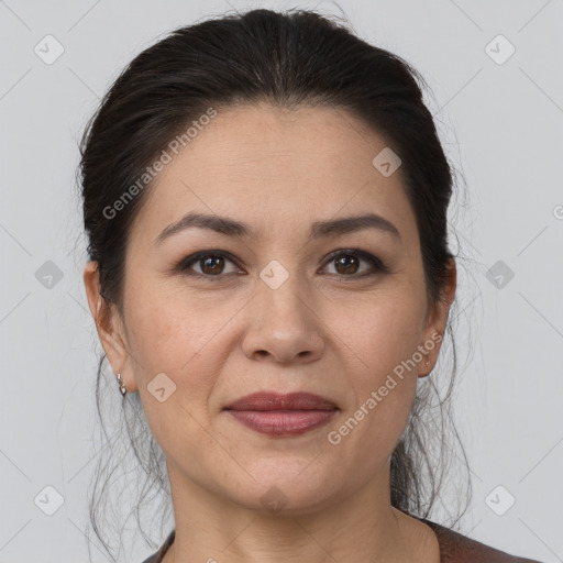 Joyful white adult female with medium  brown hair and brown eyes