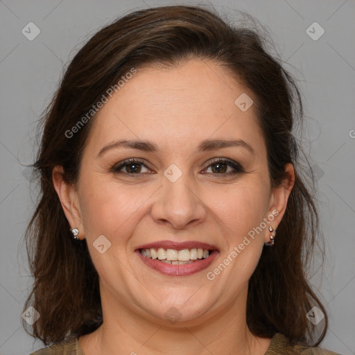 Joyful white adult female with medium  brown hair and brown eyes