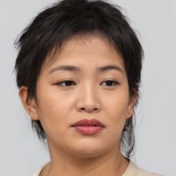 Neutral asian young-adult female with medium  brown hair and brown eyes