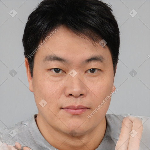 Neutral asian young-adult male with short  brown hair and brown eyes