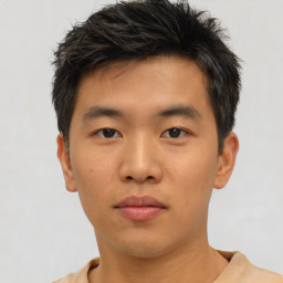 Neutral asian young-adult male with short  brown hair and brown eyes