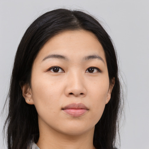 Neutral asian young-adult female with medium  brown hair and brown eyes