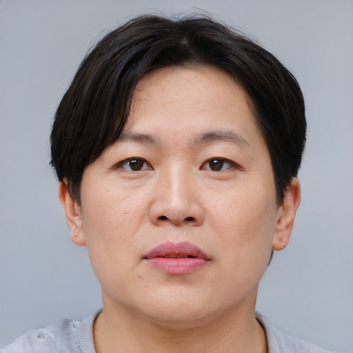 Neutral asian young-adult male with short  brown hair and brown eyes