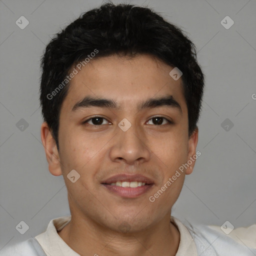 Joyful latino young-adult male with short  brown hair and brown eyes